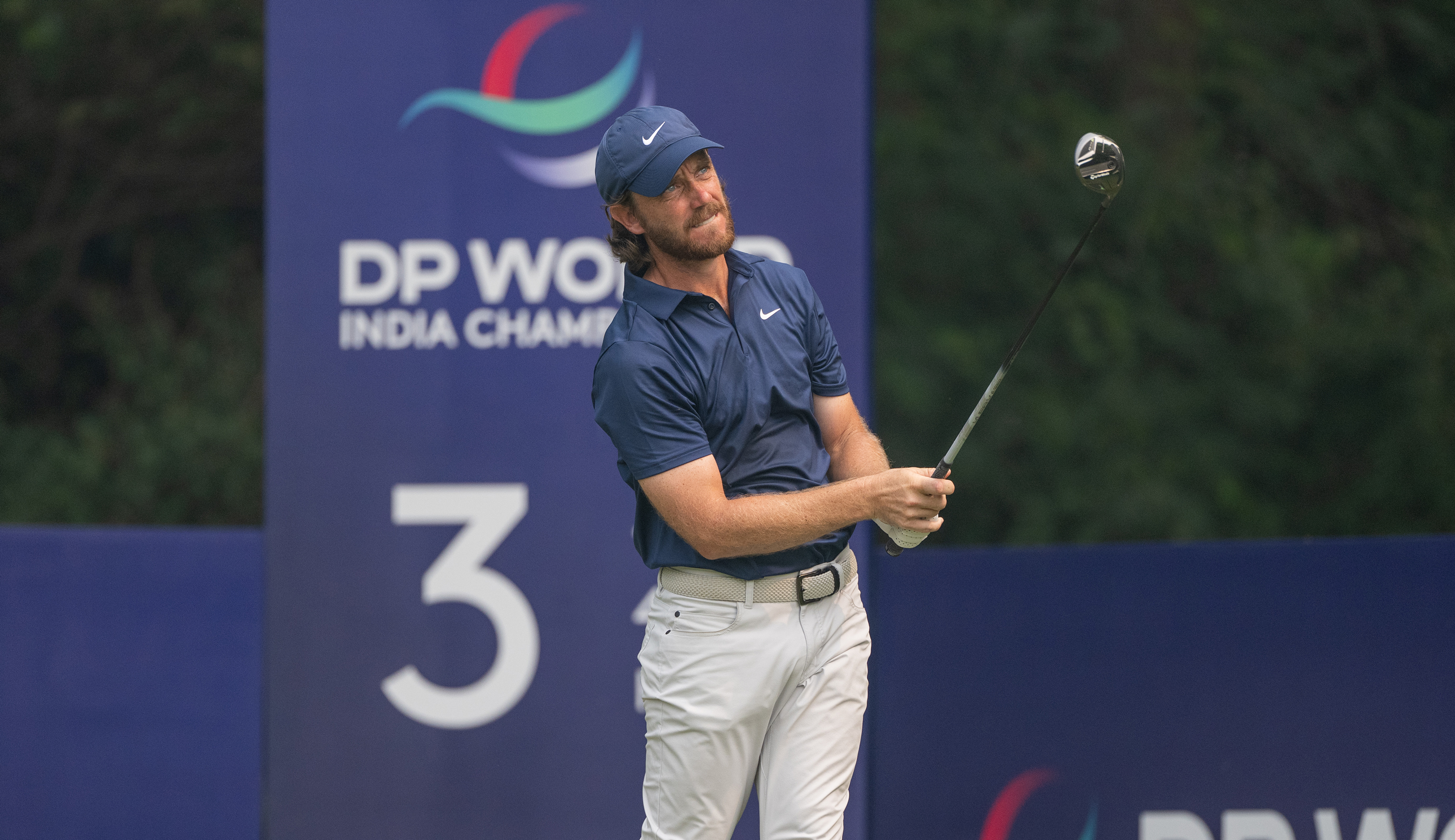 Tommy Fleetwood hits a fairway wood off the tee