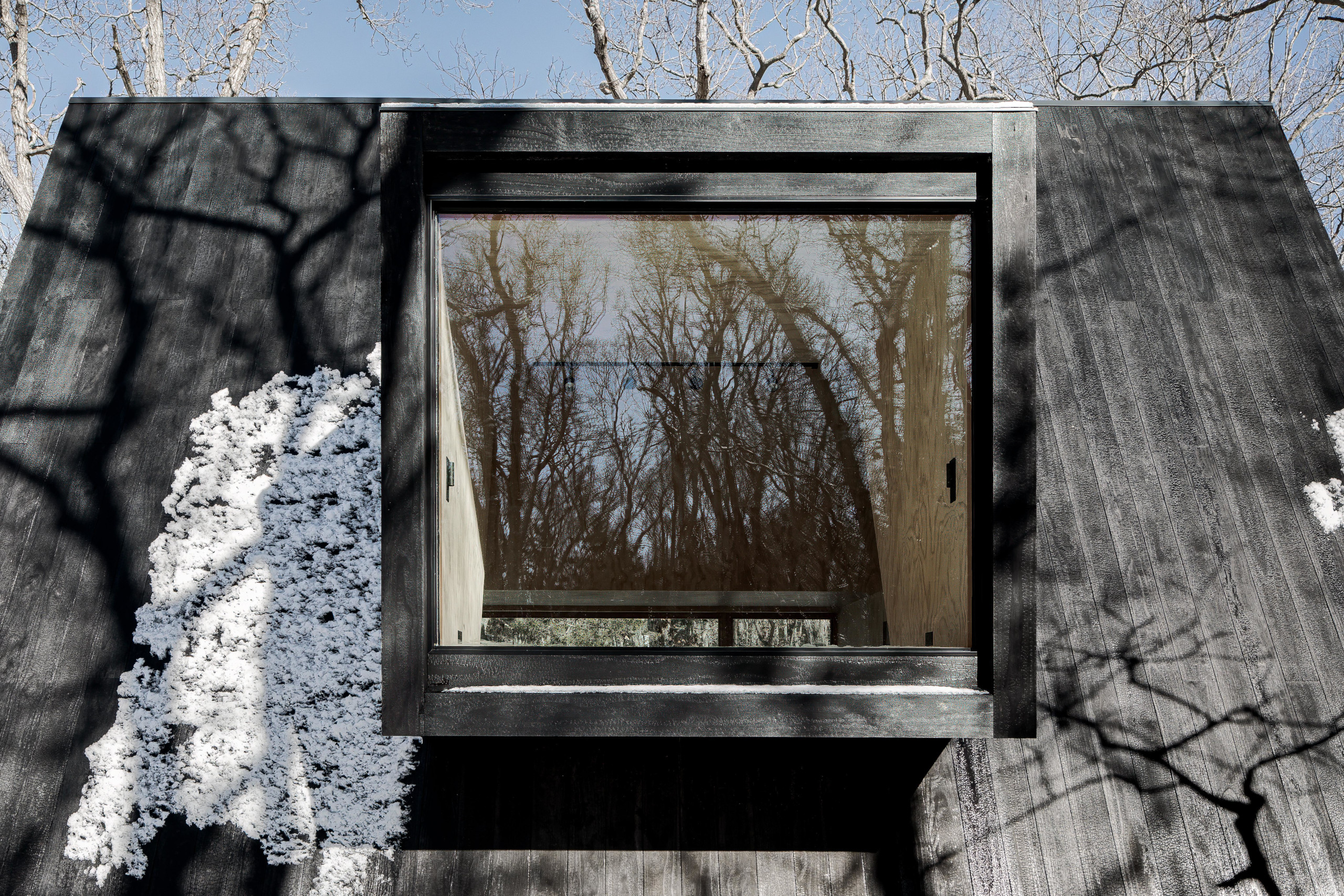 Cantilevered additions expand the interior space