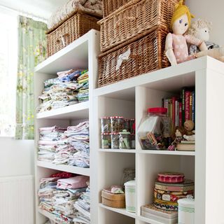 kids storage with dolls and curtain