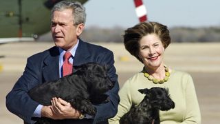George W Bush and his wife Laura with their two dogs