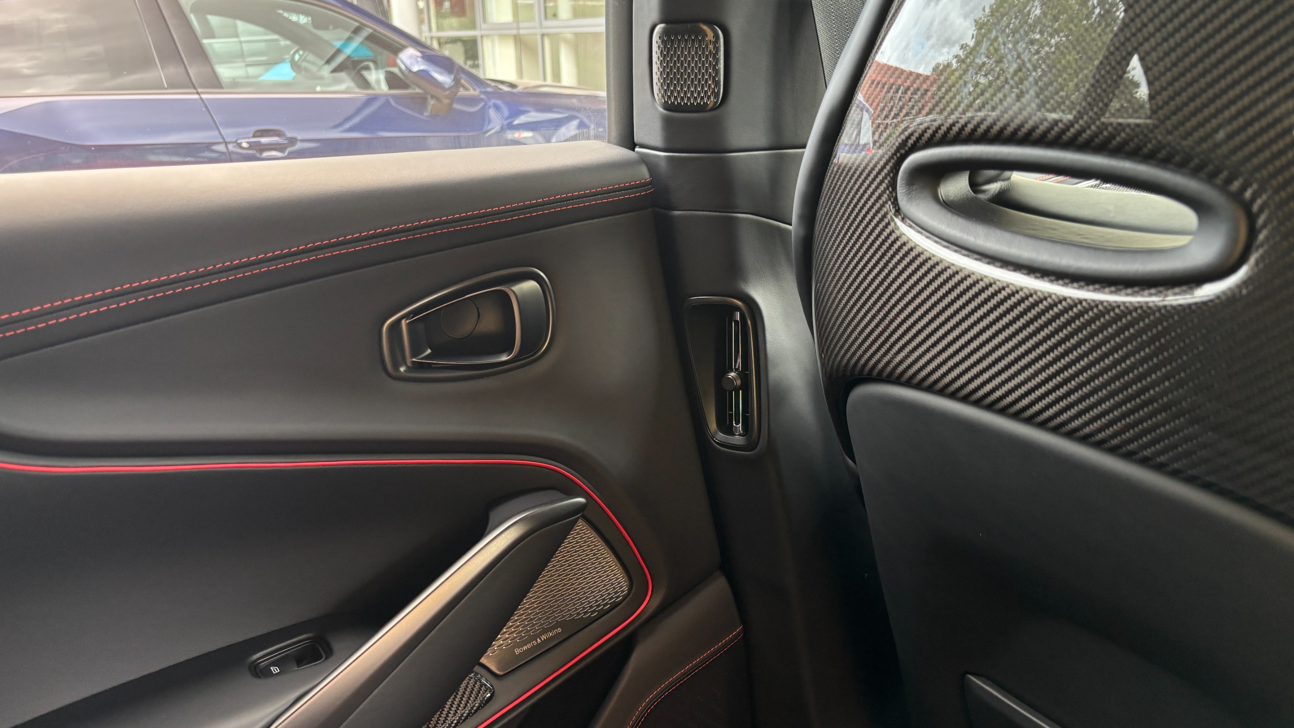 The speaker grilles in the rear doors and pillars of an Aston Martin DBX S
