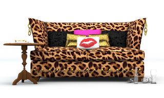 leopard print sofa with multi coloured cushions and round table