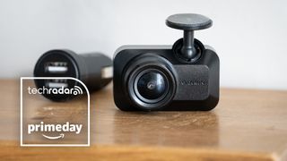 Garmin Dash Cam Mini 3 on a wooden surface