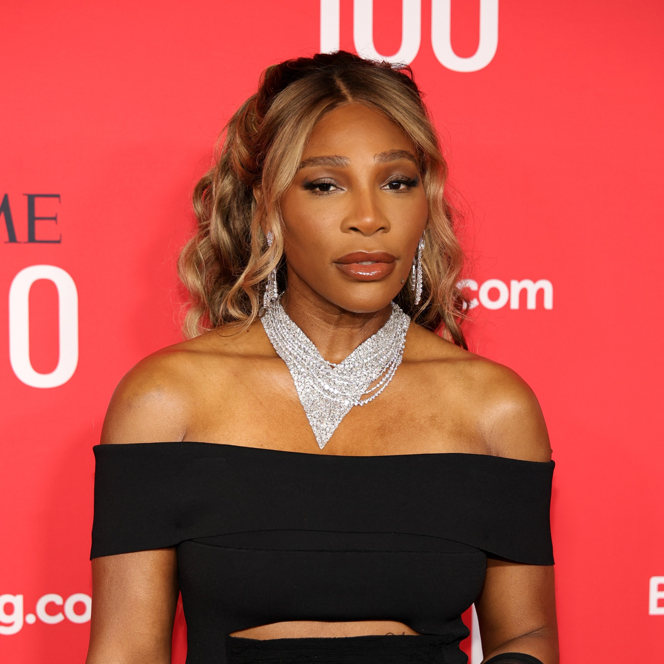 Serena Williams shows off her blonde highlights amid her dark curls.