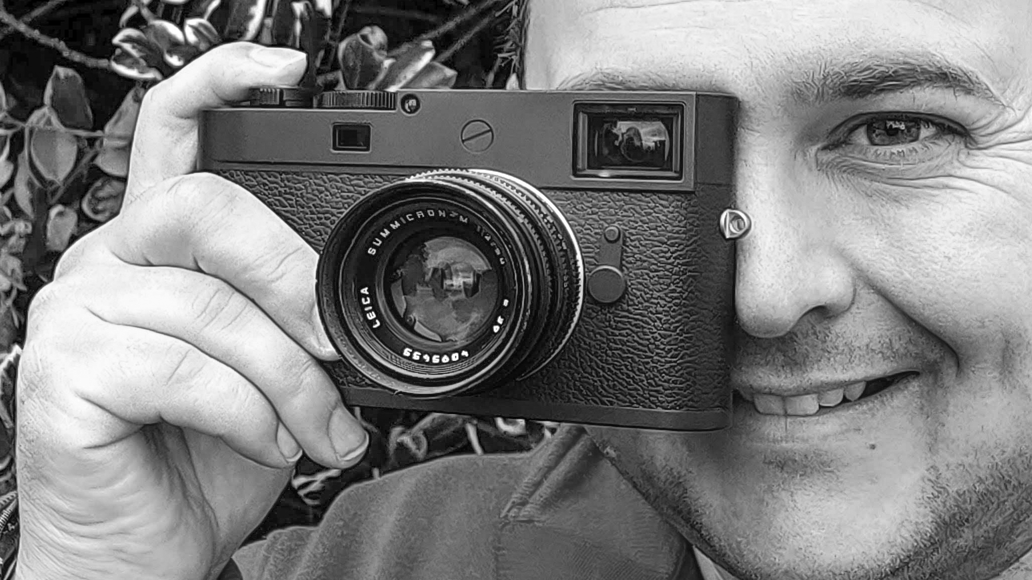 Leica M11-D held up to the eye in black and white