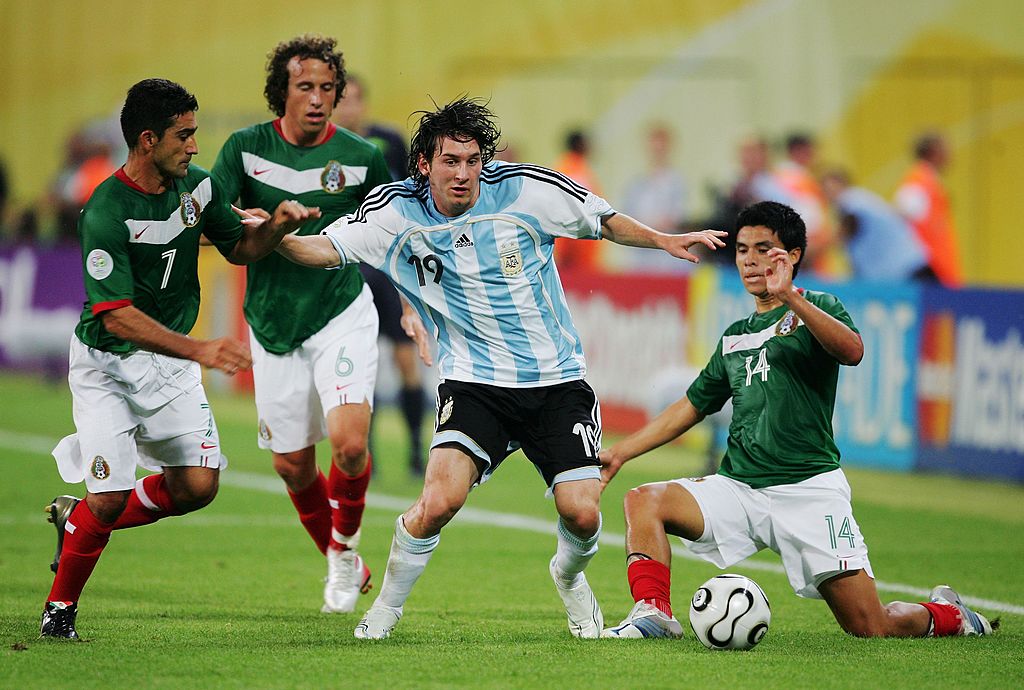 Lionel Messi of Argentina is put under pressure by Zinha, Gerardo Torrado and Gonzalo Pineda of Mexico during the FIFA World Cup Germany 2006 Round of 16 match between Argentina and Mexico played at the Zentralstadion on June 24, 2006 in Leipzig, Germany.