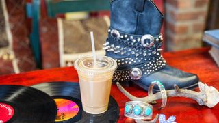 Table, Boot, Drinkware, Gramophone record, Drinking straw, Non-alcoholic beverage, Coffee, Snow boot, Costume accessory, Desk,