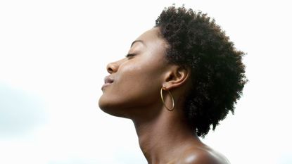 Moon breathing: A side profile of a woman breathing