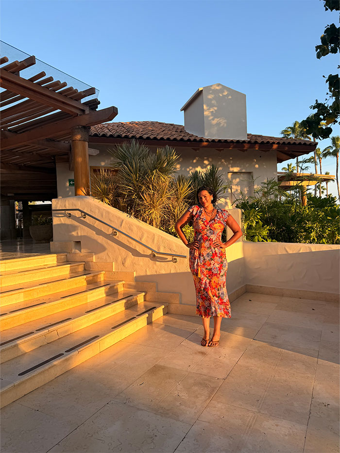 Jennifer Atilemile wearing a vacation outfit.