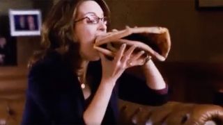 Tina Fey eating giant pizza slice on 30 Rock