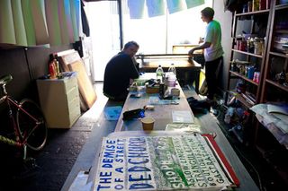 two men in a workroom/Workshop making preparations for the design festival