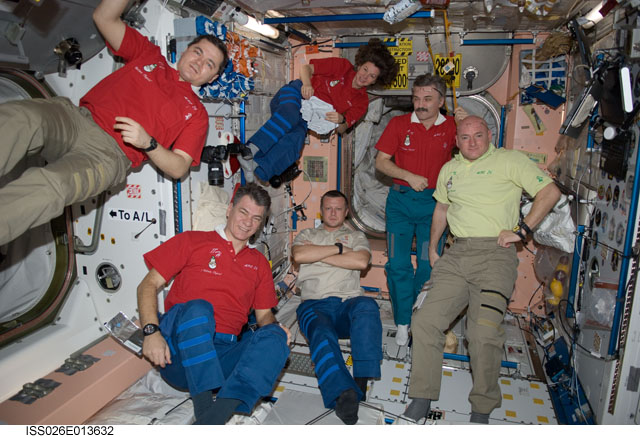 The Expedition 26 crew of the International Space Station pose for a photo on New Year&#039;s Eve to ring in 2011. Clockwise from the left are Russian cosmonaut Oleg Skripochka, NASA astronaut Catherine (Cady) Coleman, Russian cosmonaut Alexander Kaleri, all f