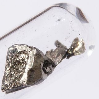 Pure lanthanum is silvery white. This is 1 gram of the element, about 1 square centimeter.
