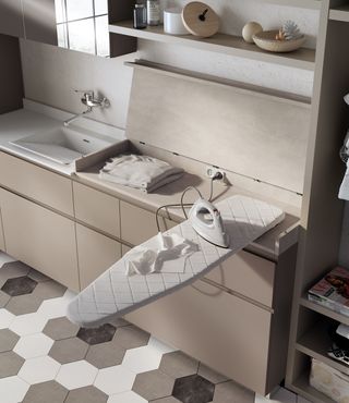 laundry room with a built in ironing board