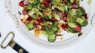 an overhead shot of brussels sprouts with chorizo and almonds