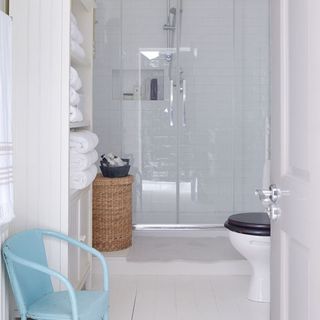 bathroom with shower area with glass partition