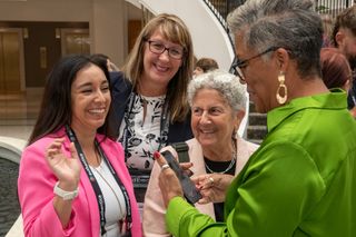 Amber Calderon, Kimberly Hulbert, Ellen Bialo, and Paula Reed get ready for the DOLS group photo.