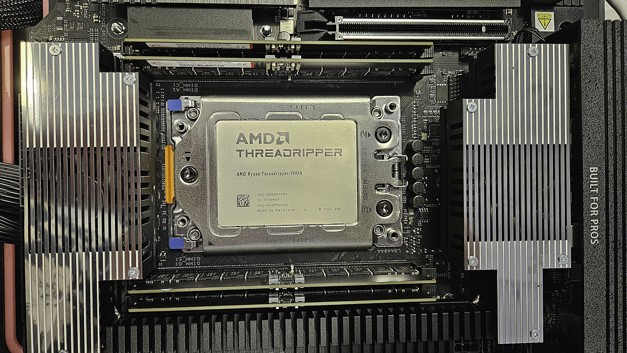 An AMD Ryzen Threadripper 9980X slotted into a motherboard