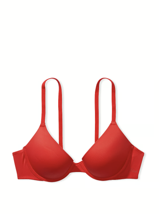 a red push up bra by Victoria's Secret in front of a plain backdrop