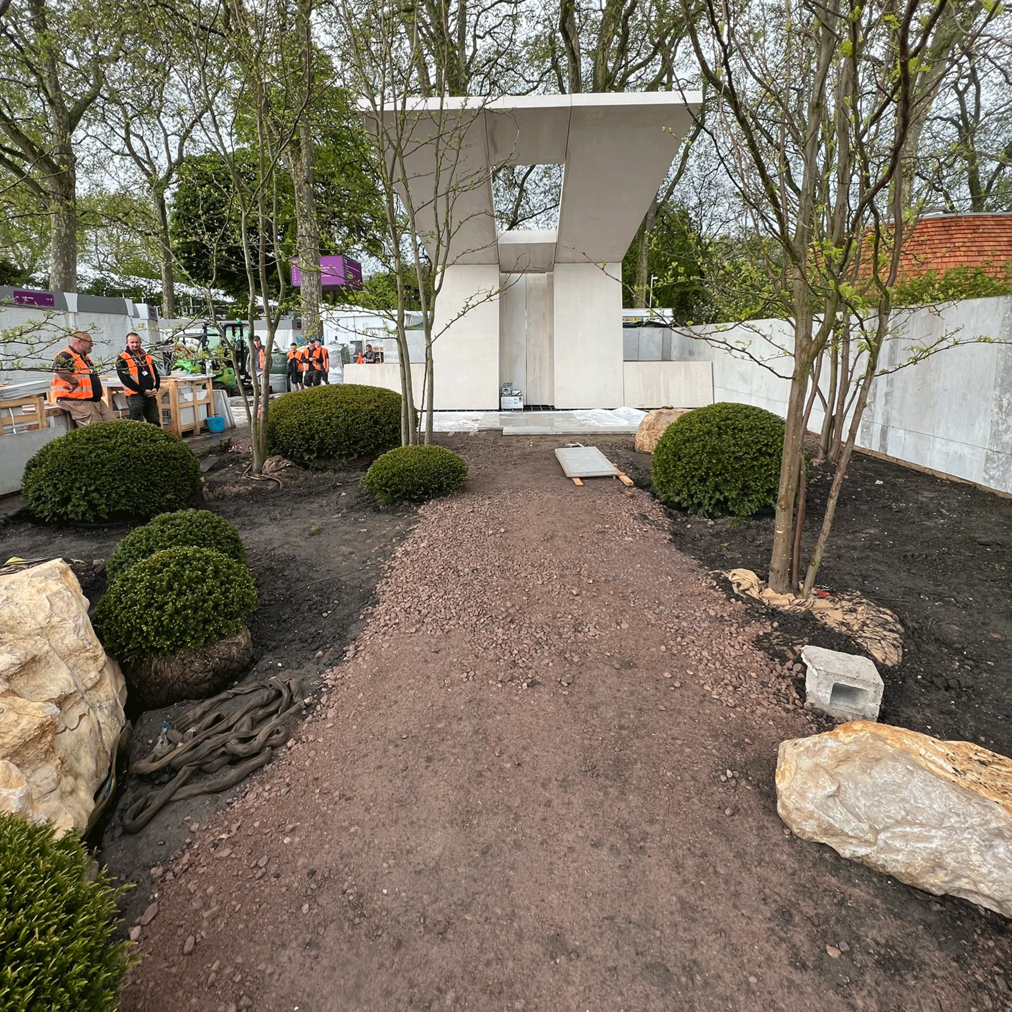 muddy garden with concrete structure