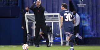 Manchester City manager Pep Guardiola, alongside Lionel Messi of PSG during the UEFA Champions League match between Paris Saint-Germain and Manchester City at the Parc des Princes on September 28, 2021 in Paris, France.