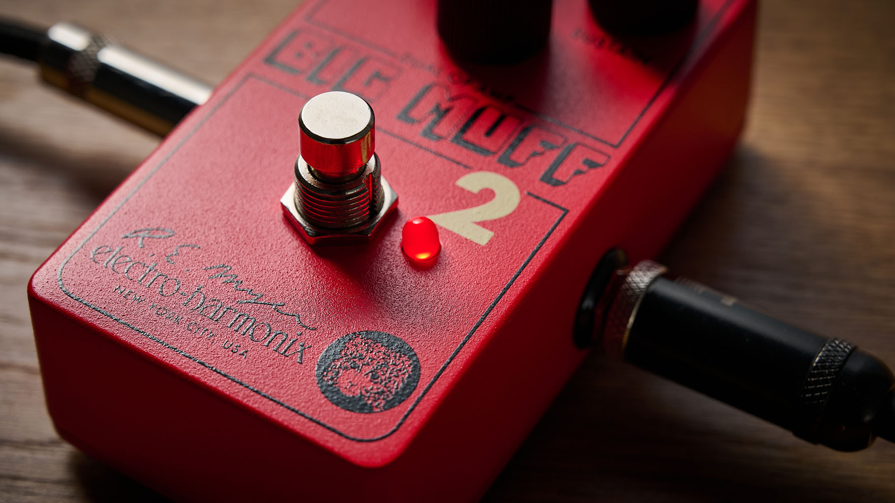Electro-Harmonix Big Muff Pi 2 Dual Op-Amp Fuzz is built from a lost schematic that's 50 years old but the form factor is familiar for contemporary EHX stompboxes, a three-knob fuzz, red enclosure.