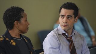Ramón Rodríguez as Will Trent sitting next to someone in the Will Trent season finale