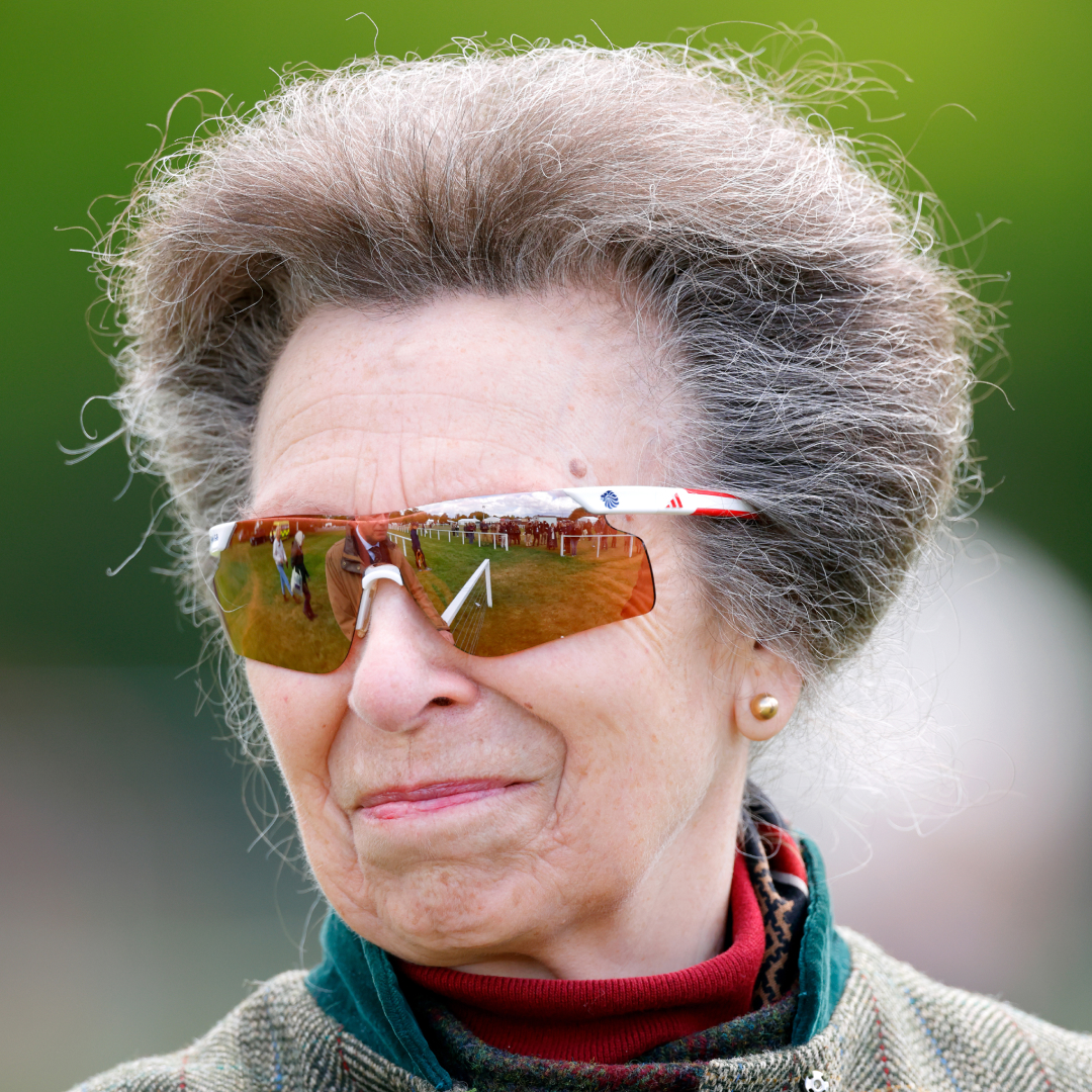 Princess Anne wearing sunglasses and smirking