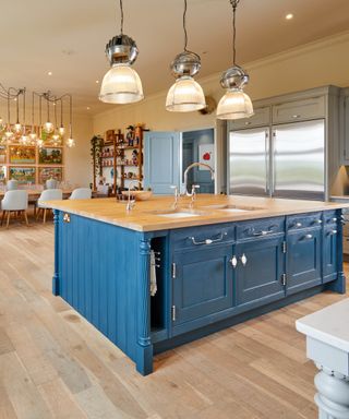 Large wooden kitchen with blue kitchen island