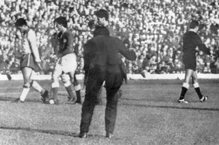 Garrincha (left) bows his head as he leaves the pitch after his red card in Brazil's World Cup semi-final win against Chile in 1962.