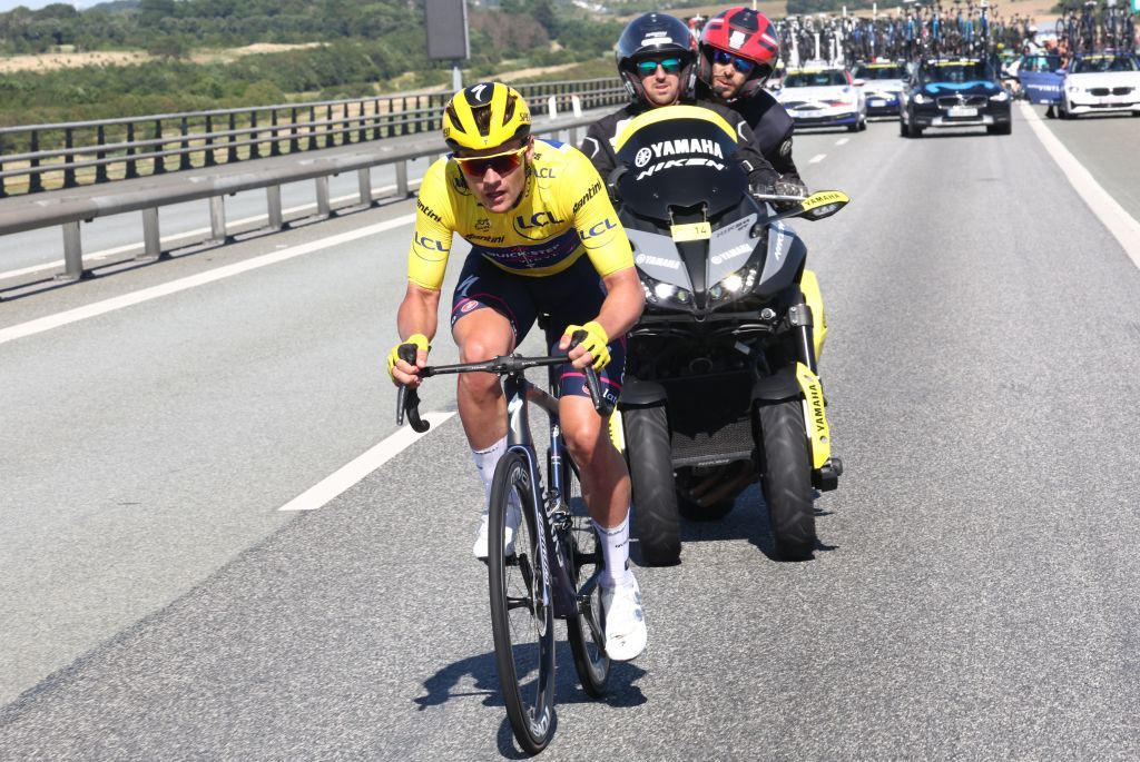 QuickStep Alpha Vinyl Teams Belgian rider Yves Lampaert wearing the overall leaders yellow jersey rides after suffering a crash with Totalenergies teams French rider Anthony Turgis EF EducationEasypost teams Portuguese rider Ruben Antonio Almeida Guerreiro and BB HotelsKTM teams Italian rider Luca Mozzato on a bridge in the final kilometers of the 2nd stage of the 109th edition of the Tour de France cycling race 2022 km between Roskilde and Nyborg in Denmark on July 2 2022 Photo by Etienne GARNIER POOL AFP Photo by ETIENNE GARNIERPOOLAFP via Getty Images