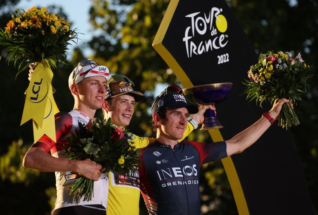 JumboVisma teams Danish rider Jonas Vingegaard C celebrates his overall victory with the yellow jersey next to UAE Team Emirates teams Slovenian rider Tadej Pogacar L placing overall second place and Ineos Grenadiers teams British rider Geraint Thomas R taking overall third place on the podium after the 21st and final stage of the 109th edition of the Tour de France cycling race 1156 km between La Defense Arena in Nanterre outside Paris and the ChampsElysees in Paris France on July 24 2022 Photo by Thomas SAMSON AFP Photo by THOMAS SAMSONAFP via Getty Images