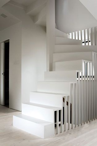 A photograph of a staircase leading to a roof terrace in a family home