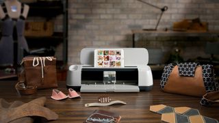 Lifestyle shot of Cricut Maker sitting on one of the best craft tables