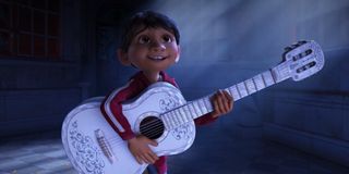 Miguel playing what he believes is his great-great-grandfather's guitar in Coco