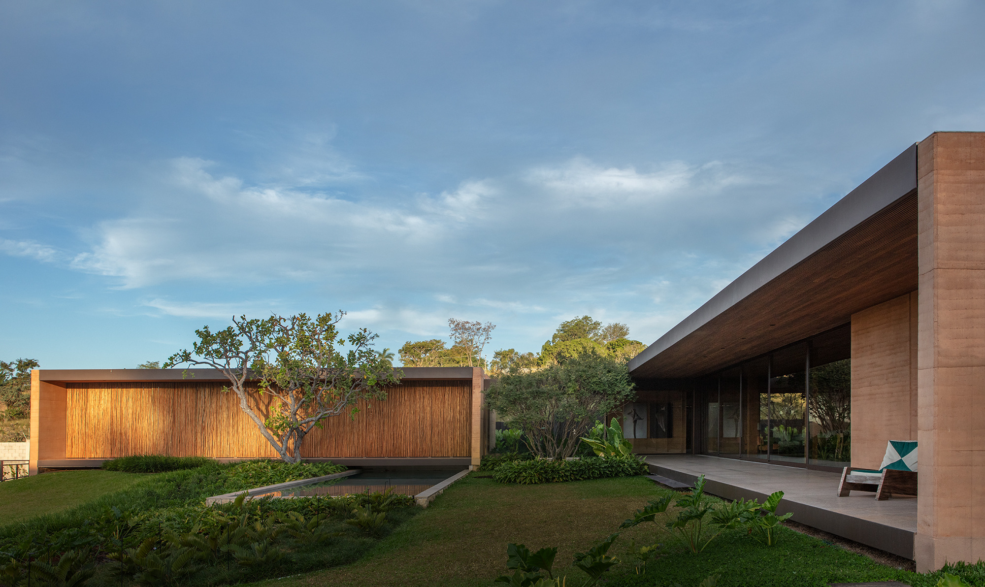 The living wing on the right is flanked by the bedroom wing to the left