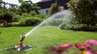 Gardena sprinkler in use watering a lawn