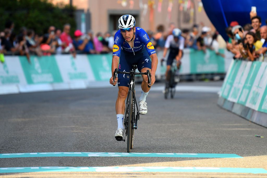 BOLOGNASAN LUCA ITALY OCTOBER 02 Joao Almeida of Portugal and Team Deceuninck QuickStep crosses the finishing line in second place during the 104th Giro DellEmilia 2021 a 1953km race from Casalecchio di Reno to San Luca 267m gsemilia on October 02 2021 in San Luca Italy Photo by Dario BelingheriGetty Images
