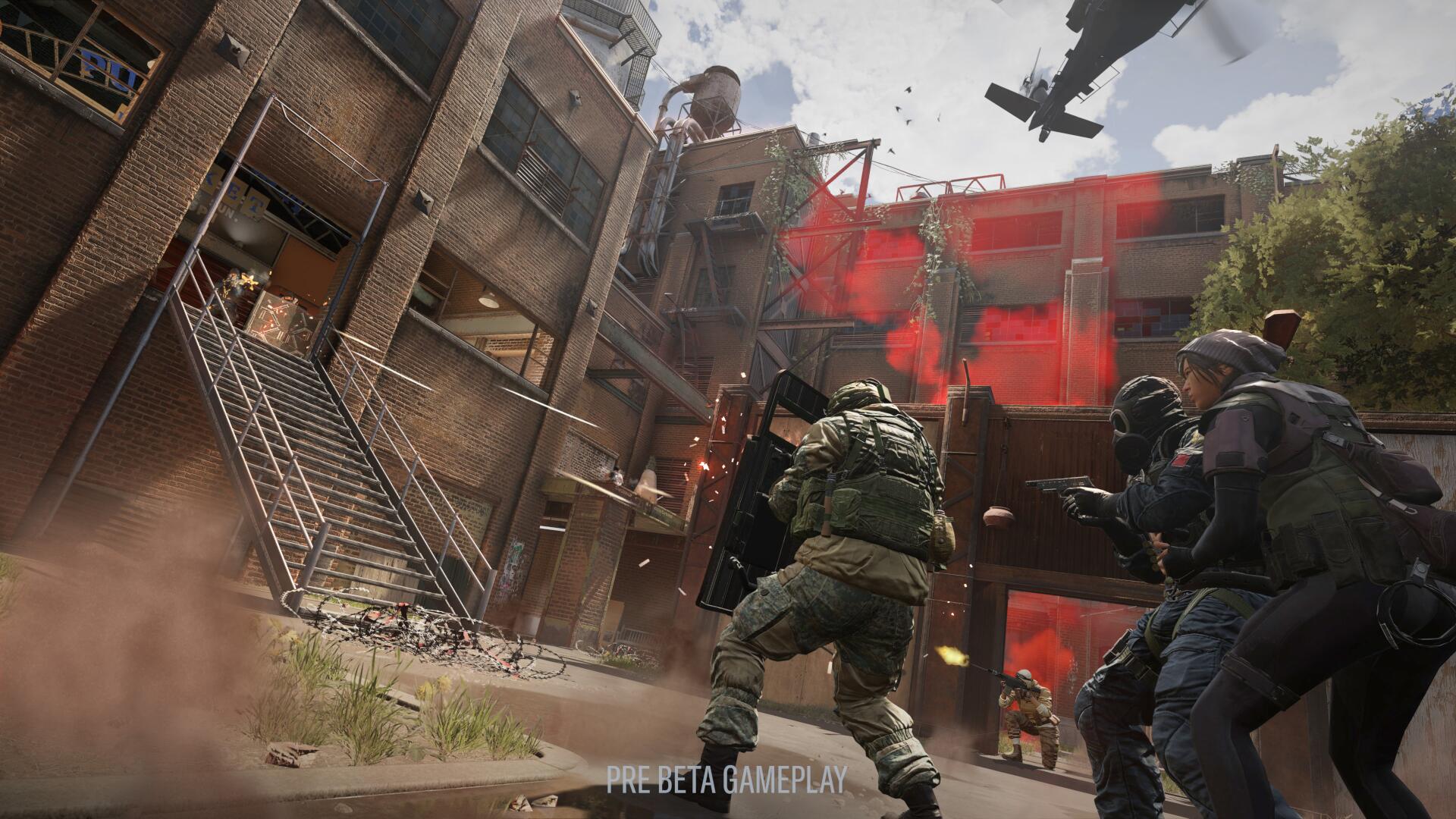 A squad of players move through the courtyard in the District map in Tom Clancy's Rainbow Six Siege X, during the Dual Front mode
