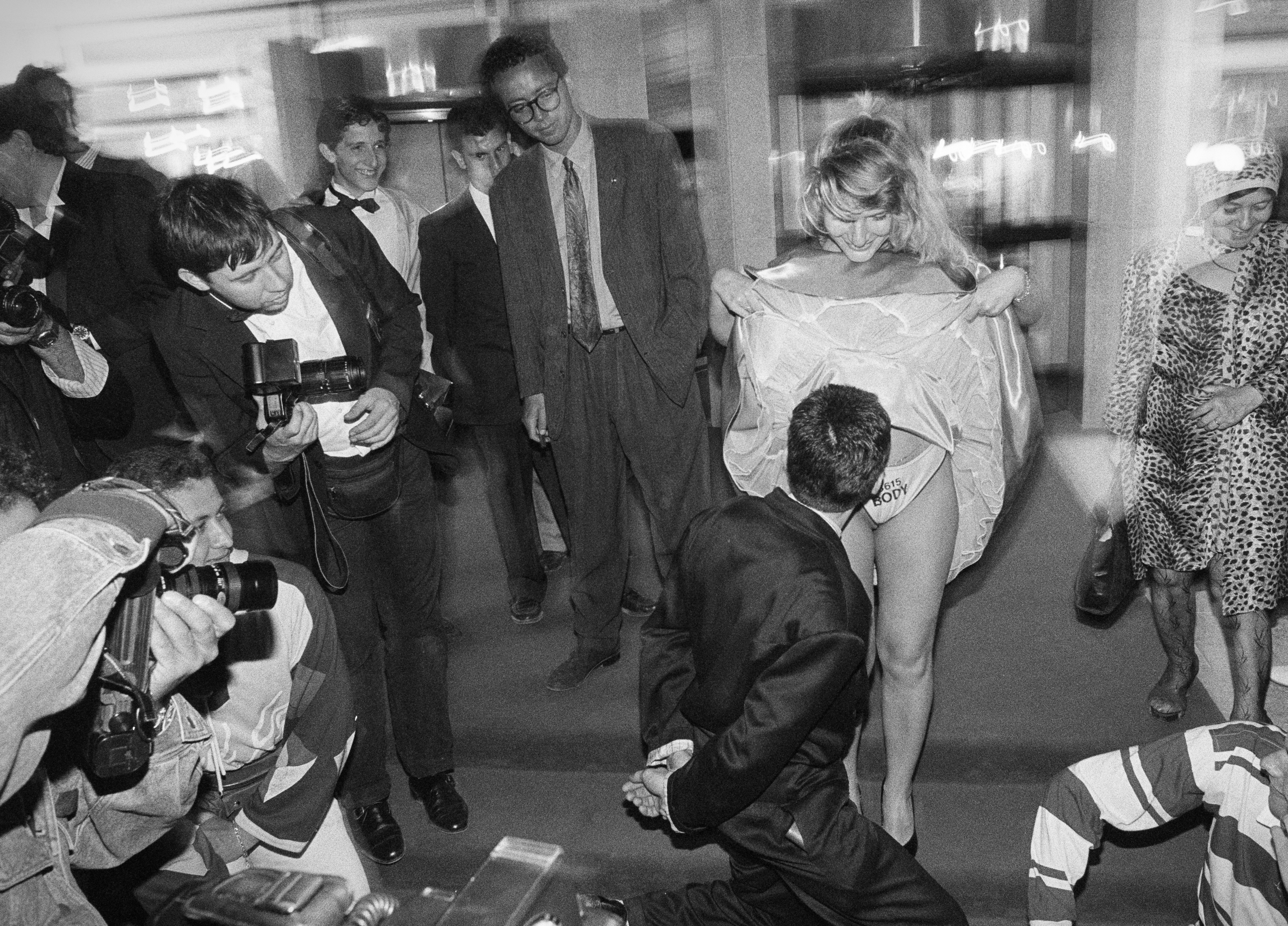 woman raises skirt