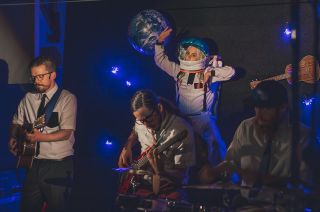 Walk Off the Earth, including band members Gianni Nicassio and Sarah Blackwood, incorporated Velcro Brand products into their rendition of "Walking on the Moon" as a musical instrument and as a prop for the music video's nods to Apollo 11 history.