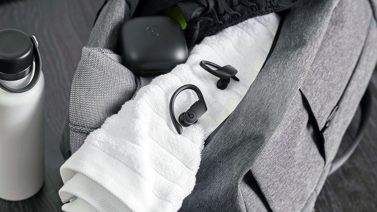 Beats Powerbeats Pro, our pick for best running earbuds, pictured on a sports towel