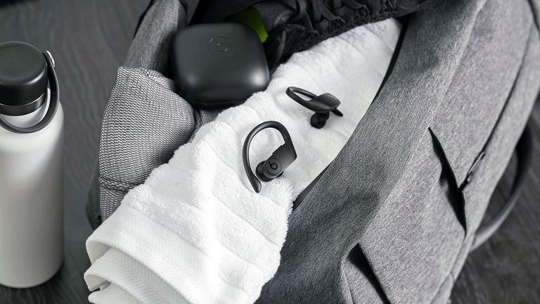 Beats Powerbeats Pro, our pick for best running earbuds, pictured on a sports towel