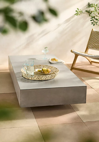 Rectangular concrete outdoor coffee table.