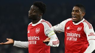 Bukayo Saka of Arsenal celebrates scoring his team's first goal with teammate Cristhian Mosquera during the Premier League match between Brighton & Hove Albion and Arsenal at Amex Stadium on March 04, 2026 in Brighton, England.
