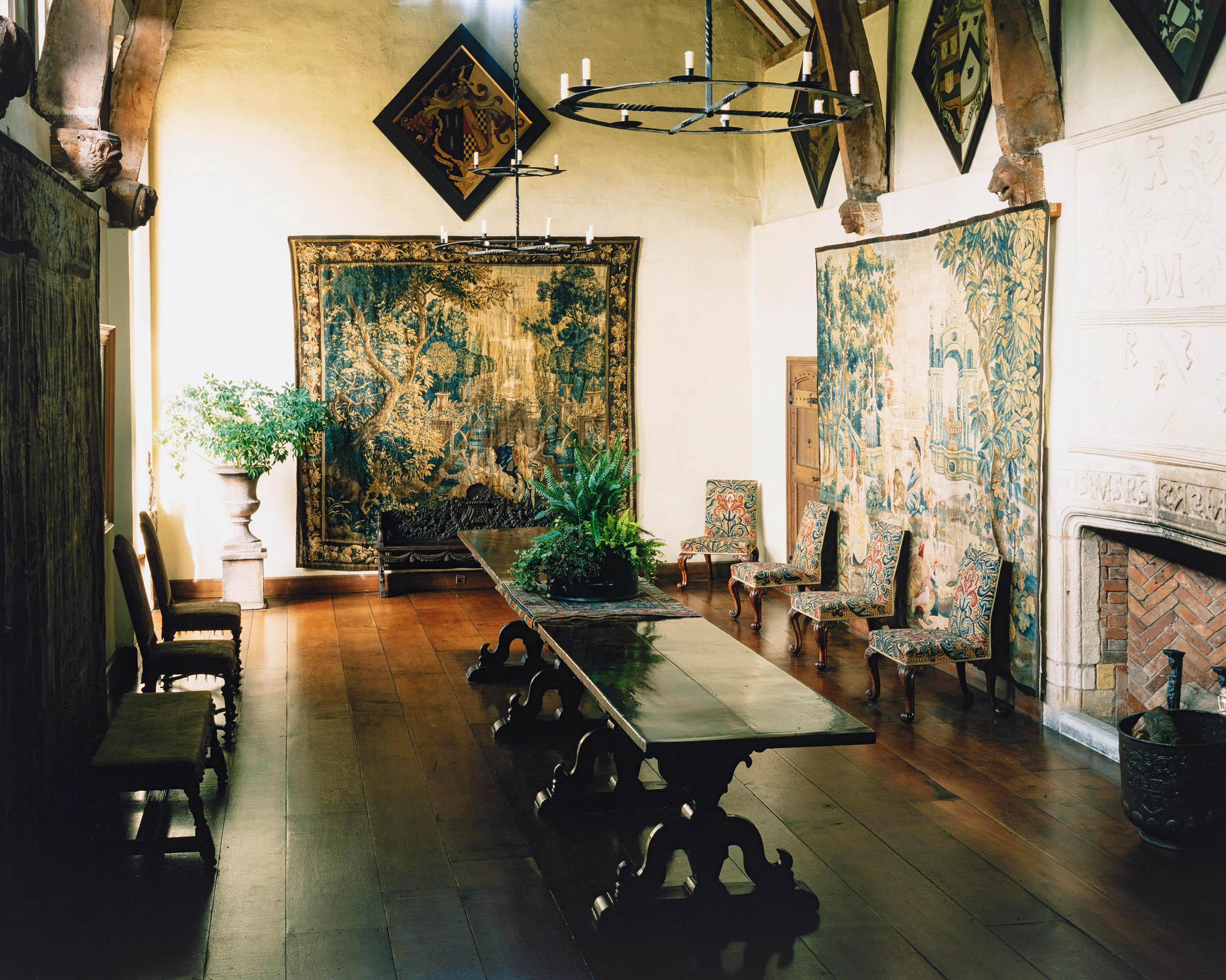 Room in a castle with tapestries and fireplace
