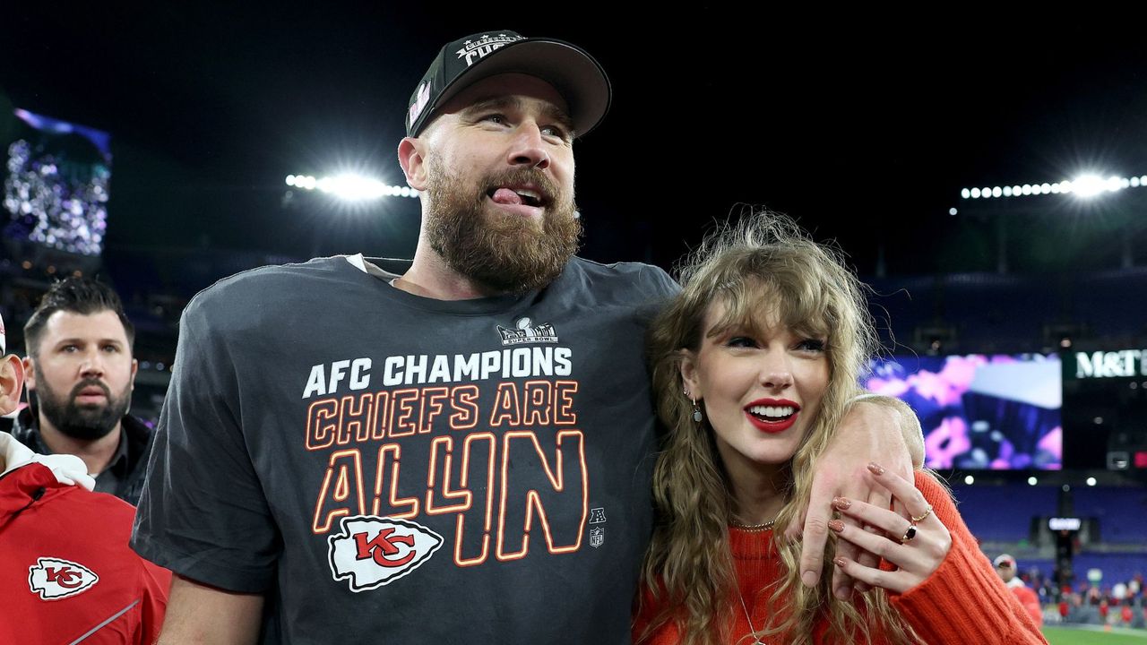 Taylor Swift and Travis Kelce smile together after a Kansas City Chiefs NFL game