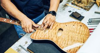 A Powers Electric A-Type in production: applying a similar amount of attention to detail to the electric builds as Taylor puts into its acoustic guitars