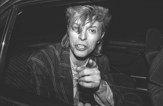 Punched by Bowie, thumped by Jagger and swatted with a newspaper by Dylan: a new book reveals what it really took to get the shot as a paparazzo, long before autofocus did the hard work