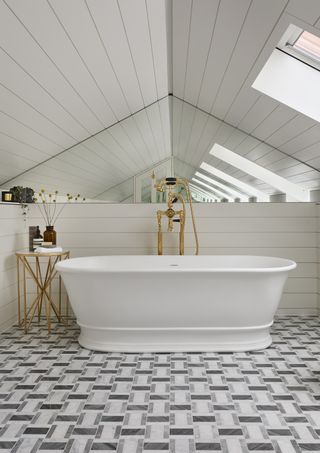 White bathroom with a geomtric marble floor